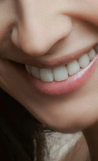 Signature Dental Aesthetics newsletter smiling woman