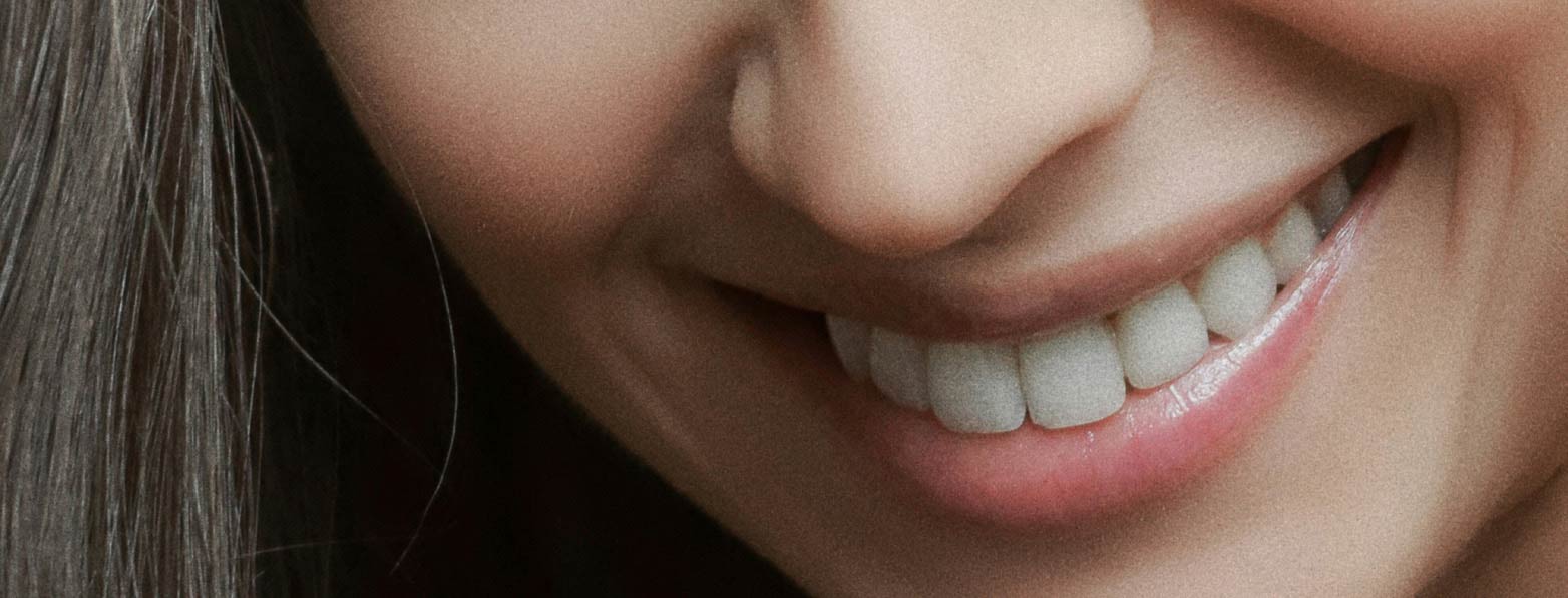 Signature Dental Aesthetics newsletter smiling woman