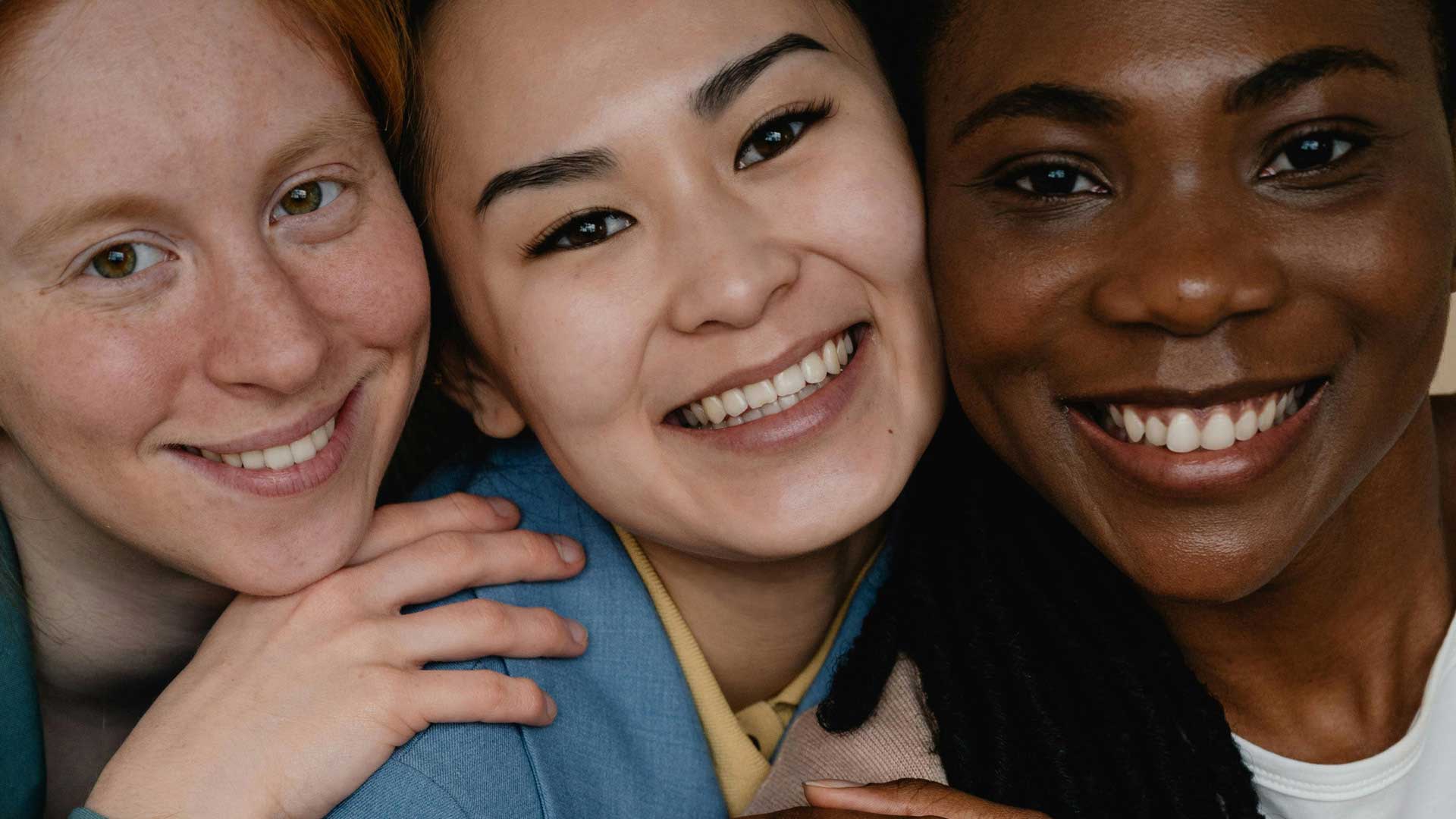 Signature Dental Aesthetics three woman smiling