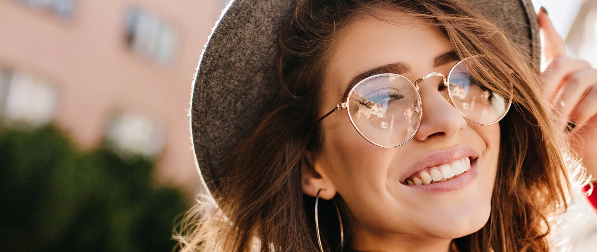 Signature Dental Aesthetics woman in hat smiling